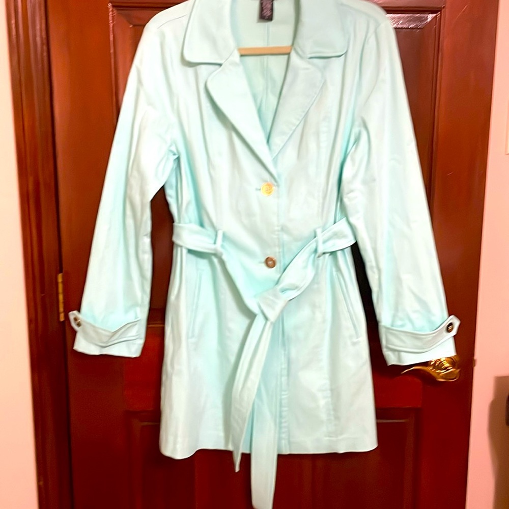 Ladies trenchcoat style raincoat. Light aqua color. Never been worn.